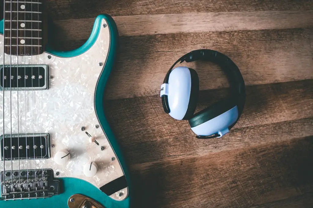 Playing Guitar With Headphone Is It Bad (Pros & Cons) Featued Image