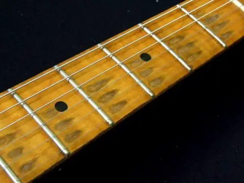 reliced guitar fretboard