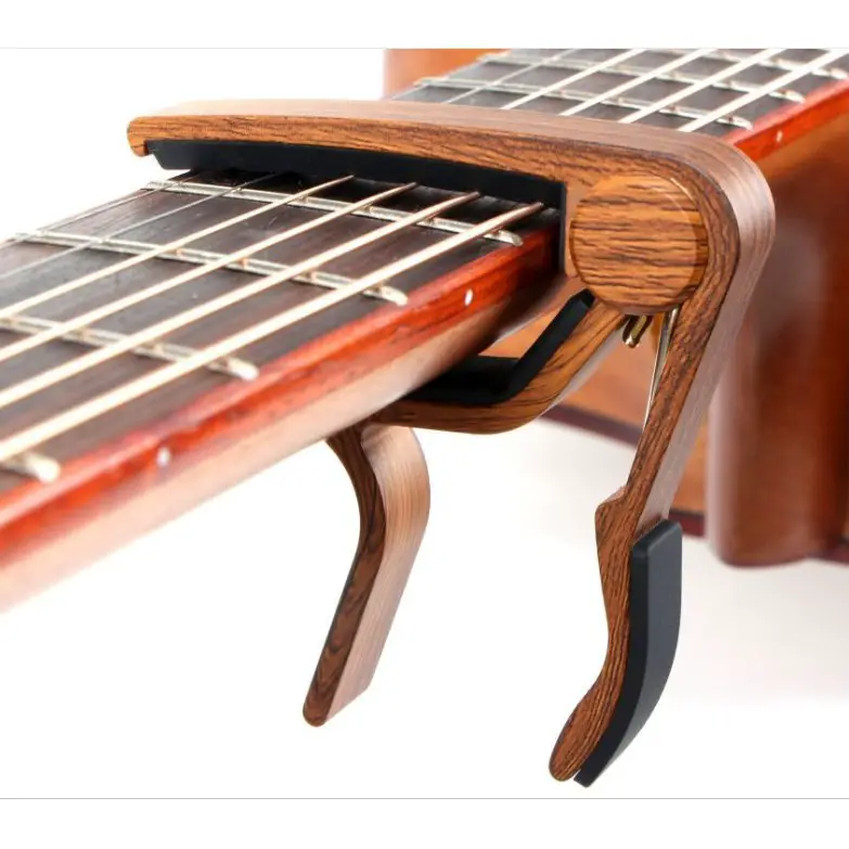 Tuning Guitar With Capo How To & Should You Do It? Strumming Bars